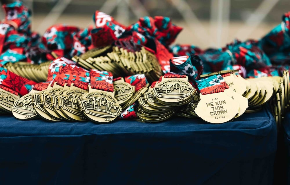 Stacks of race medals displayed on a table